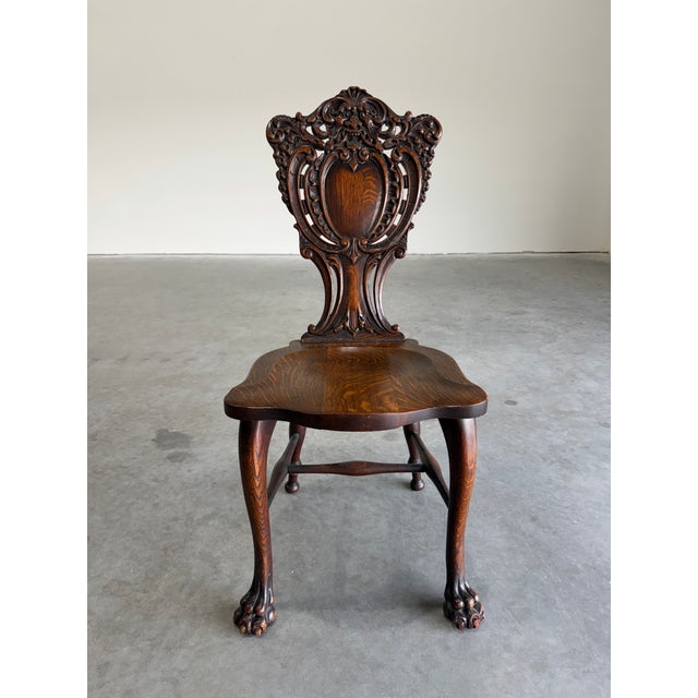 Early 20th Century Carved Oak Side Chair by Stickley and Brandt. Intricately carved backrest and claw feet at front, great...