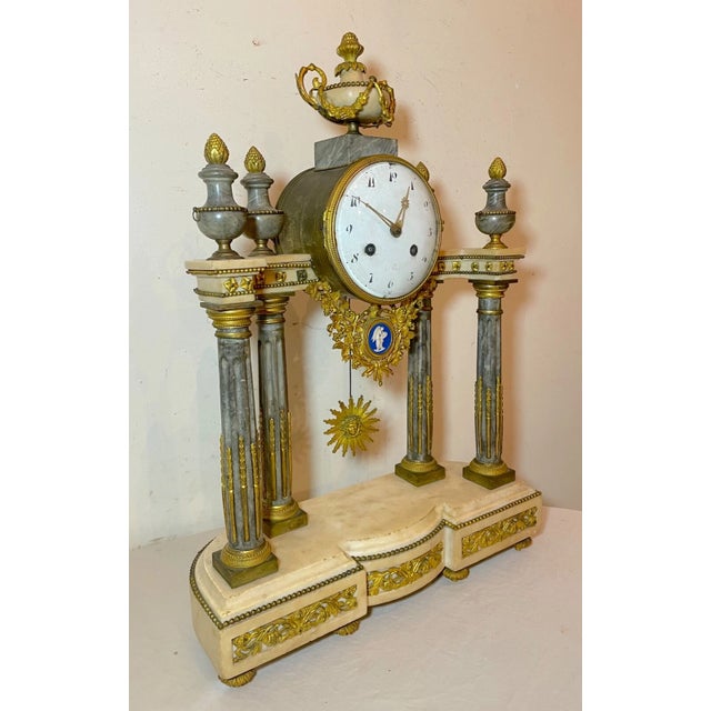 This exquisitely large mantle clock is a true piece of history. Crafted in the early 19th century, it features a stunning...