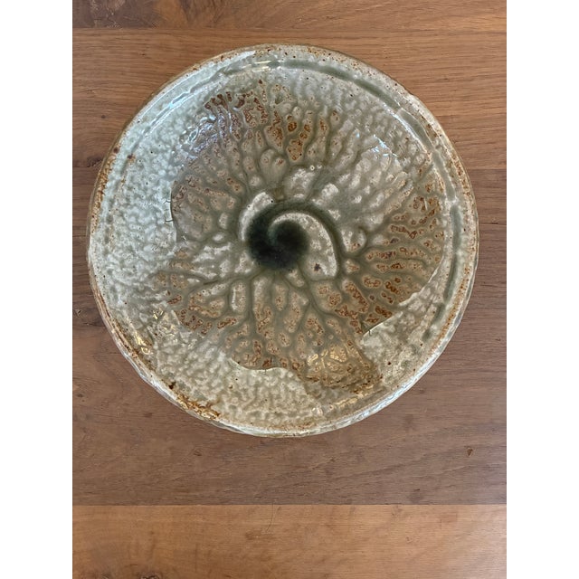 Mid Century studio pottery bowl with a crackle like finish and a medium shine glaze. This beautiful ceramic bowl features...