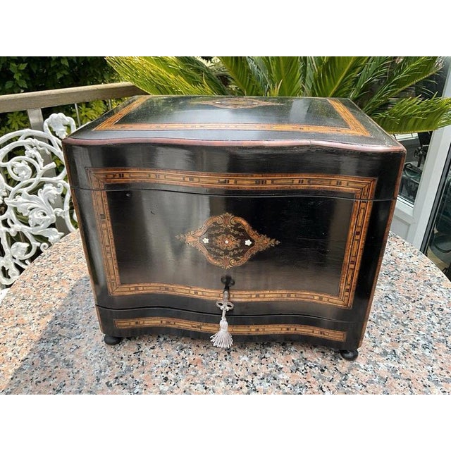 A superb and highly decorative napoleon iii-period cave à liqueur, dating to approximately 1855, complete with its...