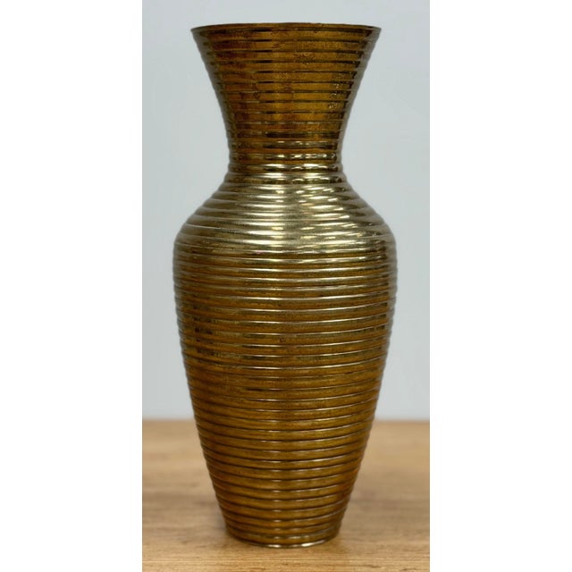 Vintage ribbed brass bud vase. Elegant form in a modern material gives this piece an interesting and versatile viability....