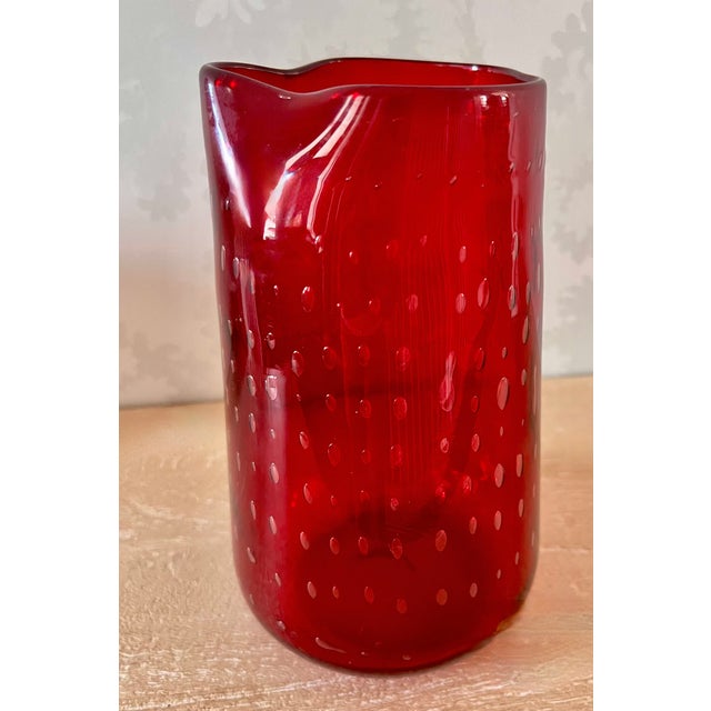 Lovely mid-century modern hand-blown art glass pitcher vase crafted in a vibrant, juicy ruby red. This heavy-walled vase...