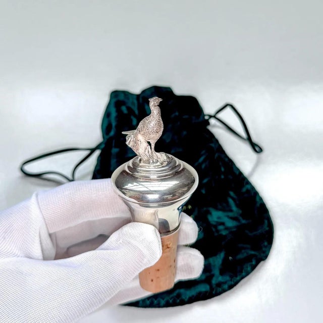• Hallmarked sterling silver bottle stopper topped with a finely detailed pheasant perched on a branch • English silver...