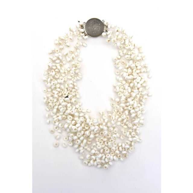 This is part of Chairish’s Costume Jewelry assortment. This wonderful and collectable vintage white multi strand signed...
