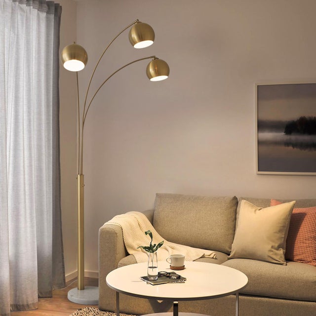 Originally designed by Peter Morelli in 1961, the Triplet Arc Floor Lamp is a timeless icon of mid-century modern design....