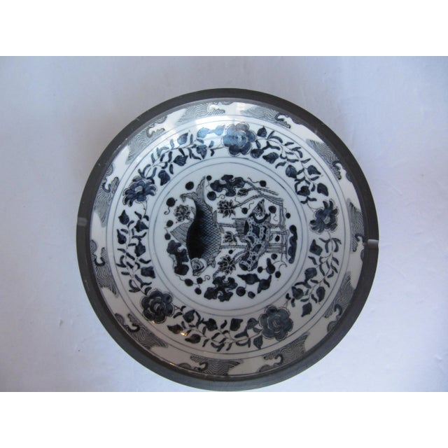 Vintage blue and white porcelain shallow bowl wrapped in metal, a wonderful addition to your collection. Combined shipping...