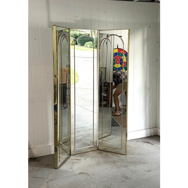 1970s glam brass/mirrored 3-panel screen/room divider. Some very minimal scuffing to brass frame in a few spots, but...