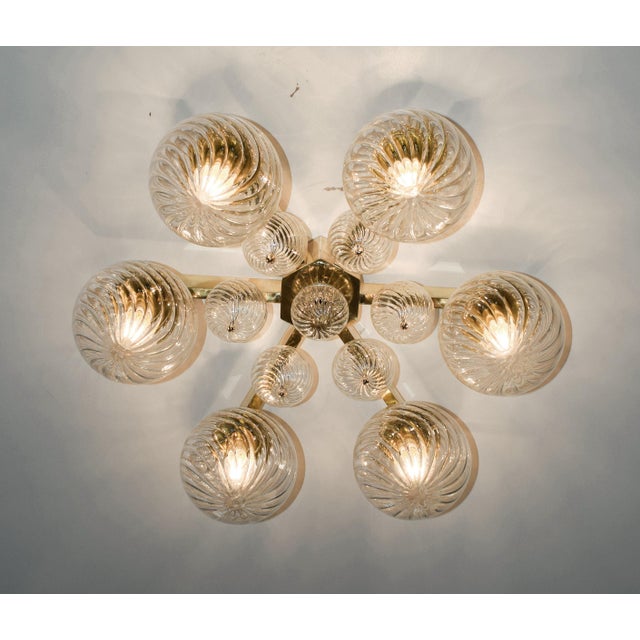 Italian modern flushmount with clear Murano glass globes with twisted texture on solid brass frame in lacquered polished...