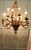 This splendid very large Chateau chandelier is made in Gilded Brass with twelve upward curved arms radiating from an...
