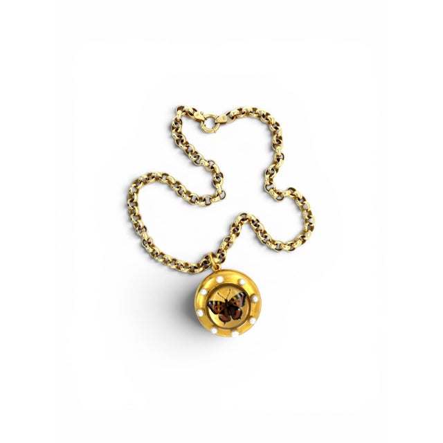 This rare antique locket boasts an intricate Essex Crystal depicting a hand painted butterfly surrounded by possibly...