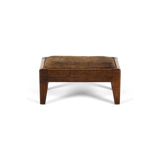 A superb original example of a sought after and rare Arts and Crafts footstool by the workshop of William Wheeler of...
