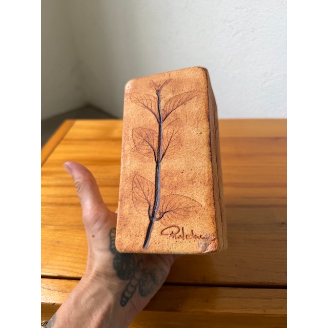 Antique ceramic vase with a herbarium motif, reminiscent of the work of Roger Capron. Signed Raymonde Le Duc in relief....