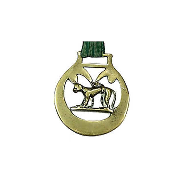 Antique English horse brass ornament of a whippet. Horse brasses were used to decorate shire and parade horses for special...