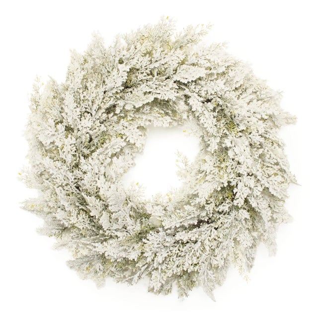 Bring the beauty of a winter wonderland to your home with this Snowy Flocked Pine Wreath. Measuring 24 inches in diameter,...