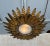 This spectacular Spanish 1950s gilt metal ceiling fixture features a double layer of small and large alternating and...