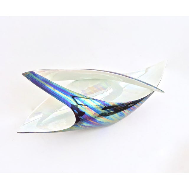 Made in italy, 1950s. this sinuous, dynamic and elegant centerpiece is made in lacquered ceramic that is varnished with...