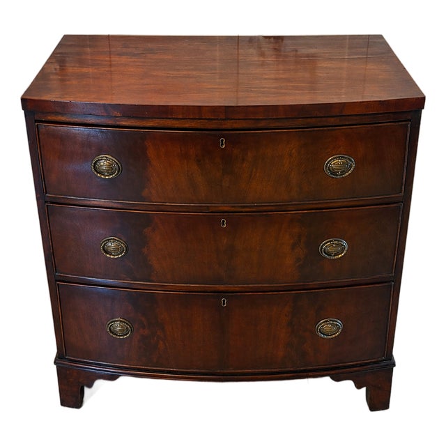 Antique Georgian Style Bow Front Chest of Drawers in Figured Mahogany with Brass Handles, 1820 For Sale