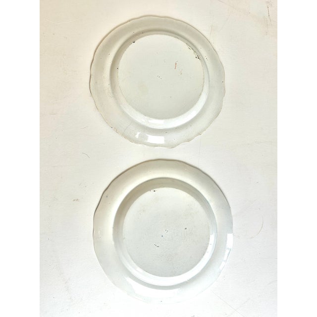 Beautiful c.1820 blue and white allegorical plates depicting a large castle with partial ruins. There are figures of...