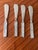A gorgeous set of four stainless spreaders featuring inlaid mother of pearl tiles. Perfect for your coastal summer soirée...