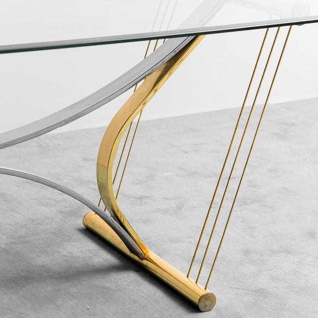 Dining table made in the 70s. Chromed and golden metal structure. Glass base. Good condition, presents signs of the time.