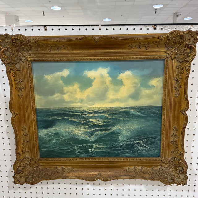 Beautiful seascape painting depicting rolling ocean waves beneath a dramatic, cloud-filled sky. The brushwork captures...