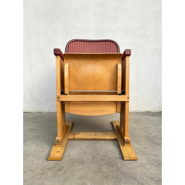 1960s East German single theatre chair, beach wood chair with a flip down seat & velvet like burgundy back rest. In very...