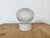 Vintage industrial ceiling or wall light made in former Czechoslivakia during the 1970s. It features a white porcelain...