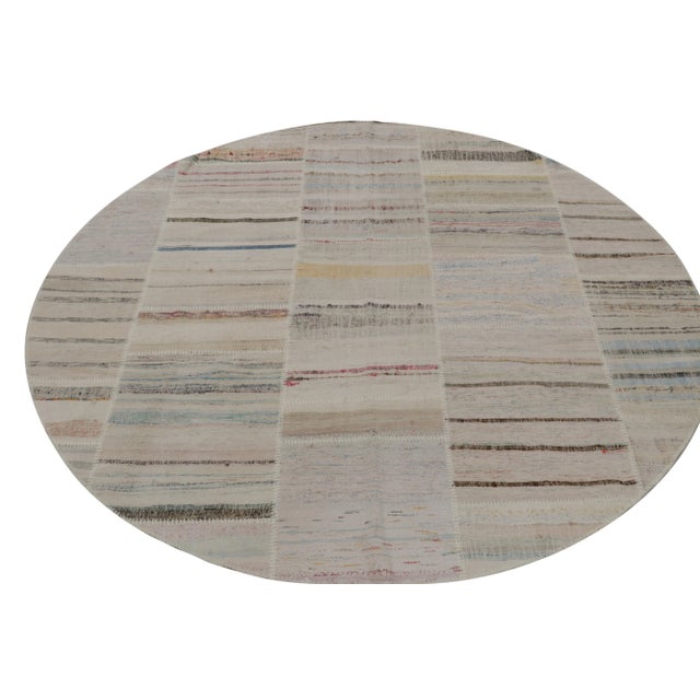 Handwoven in wool, Rug & Kilim presents a spacious 8x8 circle rug from their innovative new patchwork kilim collection. On...