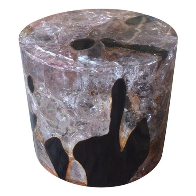 The cracked resin cocktail table is made from teak infused with resin. A dramatic piece due to the depth of the resin,...