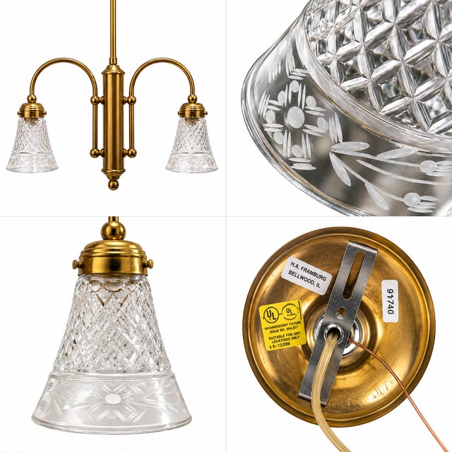 Vintage two-light hanging chandelier crafted in polished brass with a long central downrod and a symmetrical architectural...