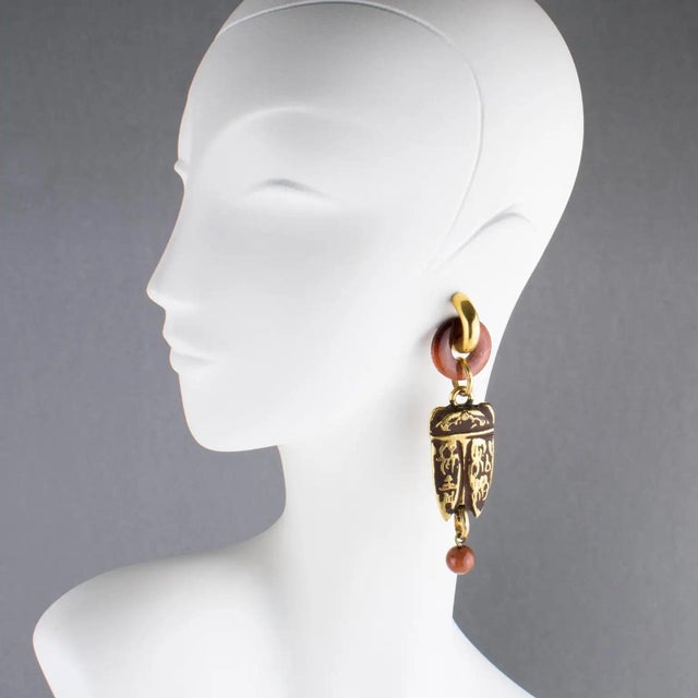 Zoe Coste France designed those stunning Boho chic dangling clip-on earrings. The dramatic flair features an ethnic design...