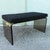 A sleek Mid-Century Modern waterfall bench crafted from sculptural smoked lucite, showcasing the clean lines and...