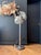 Chrome-plated metal floor lamp with hand-blown, textured Murano glass in the shape of seashells. Gray marble base....