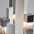 Cubic' table lamp with a nickel-plated and partially cream-coloured painted metal base. Three illuminated acrylic inserts...