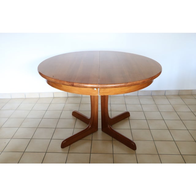 1970s solid wood extendable round table. The table has been sanded and refinished to give it the best possible base for a...