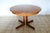 1970s solid wood extendable round table. The table has been sanded and refinished to give it the best possible base for a...