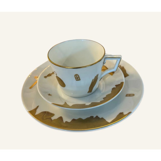 Italian Triumph” tea set decorated with elegant golden embellishment, hands, stars, and compasses. Manufactured by the...