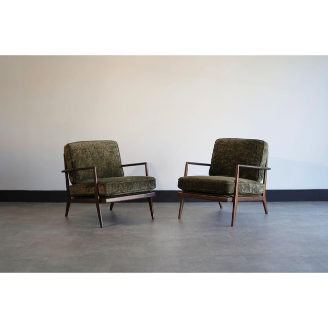 A stunning pair of vintage lounge chairs by Mel Smilow, circa 1950s. Fully restored by Stamford Modern, the solid walnut...