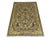 A gray field sets off scrolling vines, stylized flowers, and a small central motif in gold, cream, blue, and burgundy....
