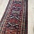 This magnificent Caucasian Kazak runner, dating back to the 1880s, is a true collector's item. Hailing from the rugged...
