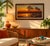 A beautiful sunset beach scene captured in a large, framed oil painting, signed by the artist. Enjoy the serene oceanfront...