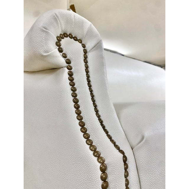 Rolled-arm sofa in a very high-quality vinyl. Pearl White. Brand New. See matching chairs for a full set. Made by world...