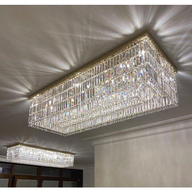 Regal flush mount chandelier 18 light in gold plating and crystal by aggiolight. Dimensions: w 300 x d 50 x h 50 cm....