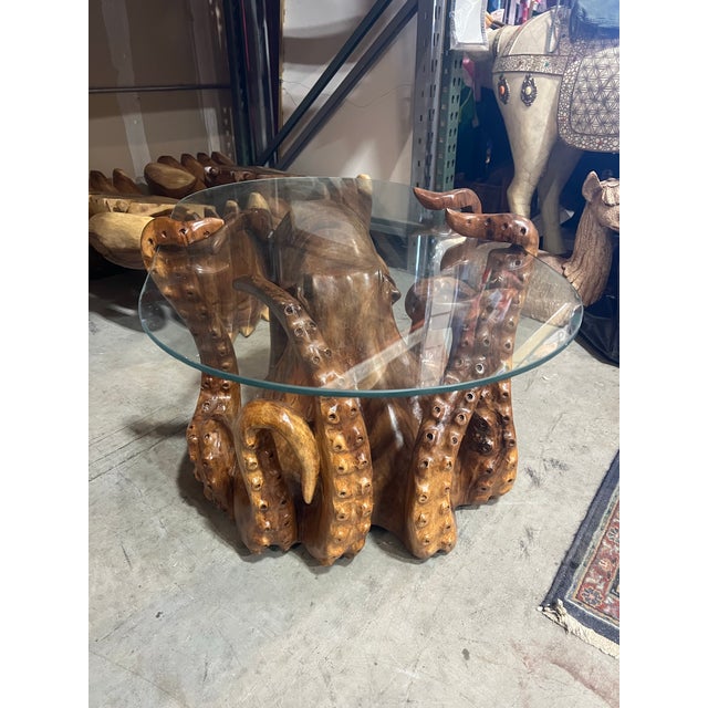 Elevate your space with this gorgeous hand, carved wooden octopus coffee table. Perfect for a beach house or ocean front...
