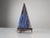 This stunning vintage table lamp features a geometric pyramid-shaped iron frame enclosing a dazzling hand-blown blue glass...