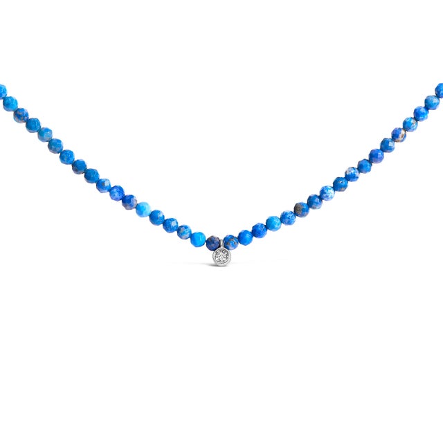 Immerse yourself in the serene allure of this elegantly handcrafted necklace, where luxurious .925 sterling silver meets...