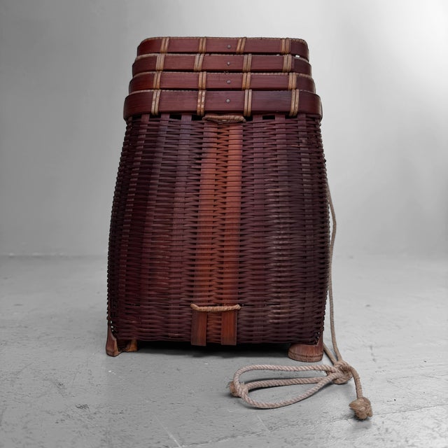 Highly decorative set of four vintage Japanese bamboo baskets, consisting of one taller basket and three lower baskets...