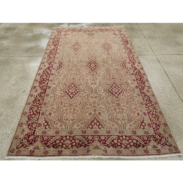 An antique Persian Tabriz accent rug handmade during the Early 20th century. Measures: 4' 10" x 8' 2"