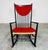 A rare 'black edition' of the iconic Hans J. Wegner J16 rocking chair having perfect Rush seat with original red hanging...