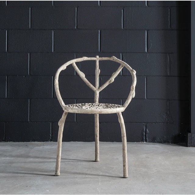 New special order item. Not vintage. The three-legged construction of this Faux Bois Chair makes is immediately eye-...